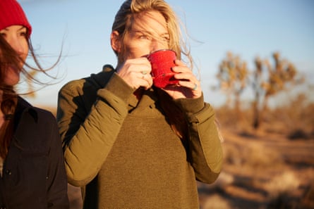 Woman drinking a hot drink outside