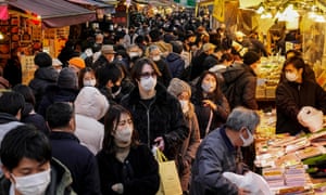 Shoppers in Tokyo, Japan on 28 December.