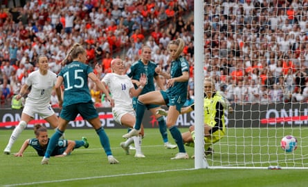 Chloe Kelly pokes home the winning goal for England.