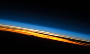 Earth from orbit. Above the orange strip of the troposphere and lighter coloured stratosphere, lies the mesosphere in the blue layer – location of the sound channels.
