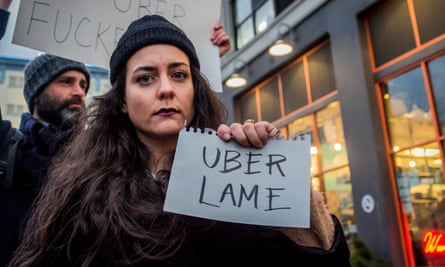 Dozens protest outside Uber’s headquarters in Long Island City in February.