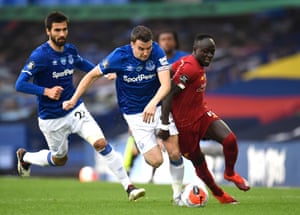 Seamus Coleman of Everton and Sadio Mane of Liverpool battle for possession.
