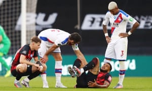 Gary Cahill of Crystal Palace checks on Joshua King of AFC Bournemouth following a tackle.