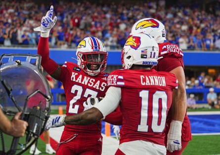 Kansas players celebrate during their match against Missouri earlier this month.