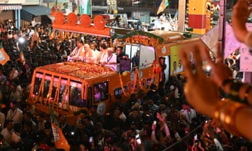 India's home minister and leader of the Bharatiya Janata Party (BJP) Amit Shah (C) greets supporters in Bengaluru, capital of Karnataka.