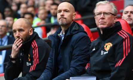 Erik ten Hag (centre) watches the match from the bench