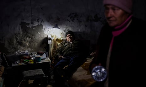 Olga and her husband Victor camp out in their basement in northern Kherson, Ukraine, as the region was cut off from water and electricity supplies on Sunday.
