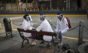 Coronavirus live news: Hong Kong bars, gyms and cinemas reopen; 20m Americans lost jobs in April 11 Pharmacy workers wait to enter their store in downtown Lima, Peru, 8 May.