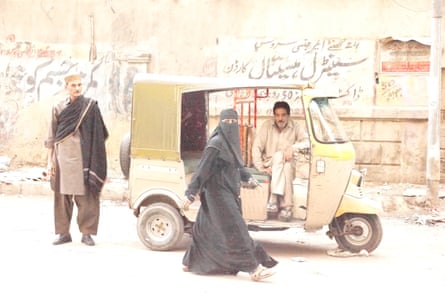 Ustad Saami (left) on the street in Karachi.