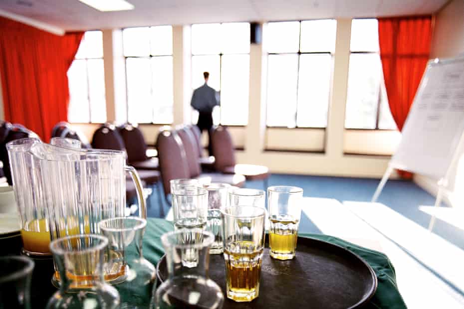 Close-up of leftover drinks on a table in a conference