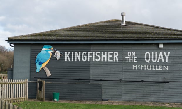 The pub sign featuring a Kingfisher