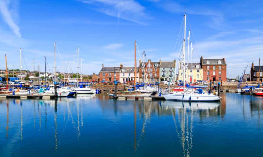 Boats reflecting in the water at Arbroath harbour