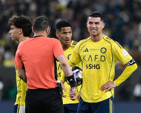 Cristiano Ronaldo grimaces while looking at the referee during a Saudi Pro League game