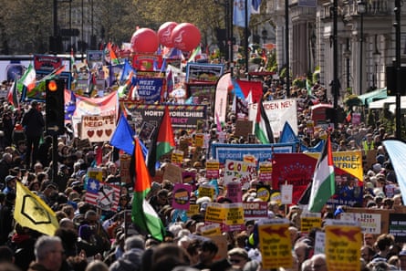 Thousands march in London holding banners