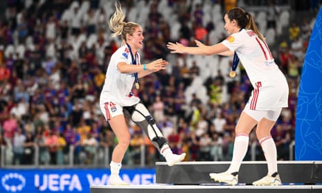 Ellie Carpenter manages to celebrate with Lyon teammate Damaris Egurrola despite her ruptured ACL sustained in the Women’s Champions League final against Barcelona.