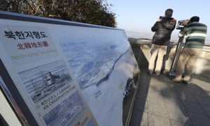 A visitor uses binoculars to see the North from the unification observatory in Paju, South Korea, on Tuesday.
