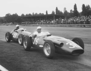 Race leader Stirling Moss is pushed to the pits by teammate Luigi Piotti after his Maserati 250F ran out of fuel.