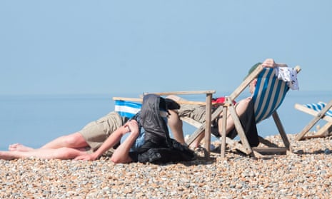 Beachgoers in Brighton enjoy the high temperatures