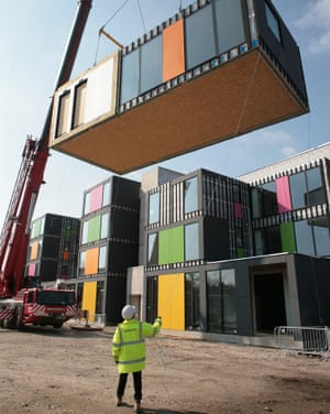 Factory-made units being delivered to the site.