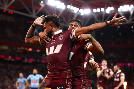 Tabuai-Fidow celebrates with Maroons teammates.