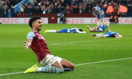 Aston Villa’s Ollie Watkins celebrates scoring their first goal as Brighton &amp; Hove Albion players look dejected.