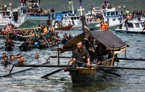 Leading the procession of boats is a small canoe tasked with carrying a small box of religious artefacts from one church at the north of Larantuka to another in the south.