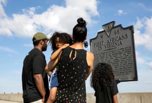 Marcie Hampton and Rod West show their children Major, 5, and Maya, 7, the place where the first Africans arrived in Virginia in 1619, on Juneteenth, which commemorates the end of slavery in Texas, two years after the 1863 Emancipation Proclamation freed slaves elsewhere in the United States, amid nationwide protests against racial inequality in Hampton, Virginia, U.S. June 19, 2020.