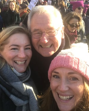 Clare with her dad and sister taking a selfie during a demonstration