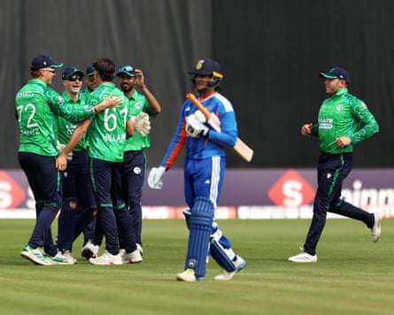 Matt Hollard (third left) celebrates pinch his teammates aft bowling retired India’s Ishan Kishan.