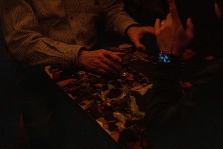 close up of a hand holding a drink on the table