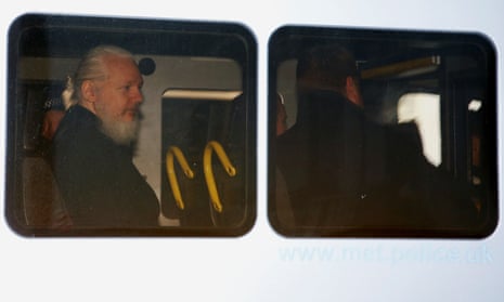 WikiLeaks founder Julian Assange is seen in a police van, after he was arrested by British police in London Thursday.