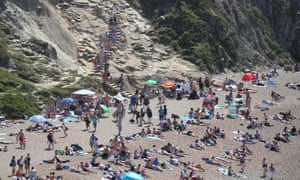 People fill the beach at Durdle Door, near Lulworth, on Sunday despite council attempts to keep in closed.