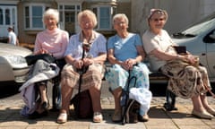 Four elderly women on a day trip to the seaside, sitting on a bench on summer afternoon. Image shot 2009. Exact date unknown.<br>BDC53D Four elderly women on a day trip to the seaside, sitting on a bench on summer afternoon. Image shot 2009. Exact date unknown.