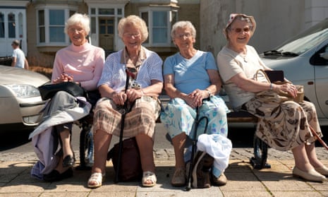 Elderly women sit on bench