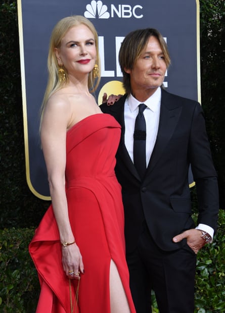 Lady in red: with her husband, the musician Keith Urban.
