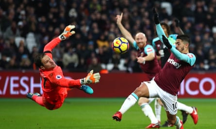 Asmir Begovic of Bournemouth (left) pulls off a save against West Ham’s Manuel Lanzini at the London Stadium in January 2018.