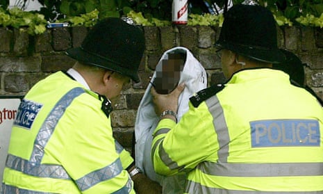 Police stop and search of a young man.