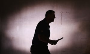 The man in black: Dockers coach Ross Lyon head back out towards the Etihad Stadium playing surface after half-time in his side’s loss to North Melbourne last week.