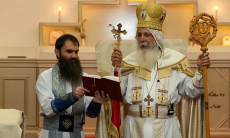 Bishop Mar Mari Emmanuel (right).