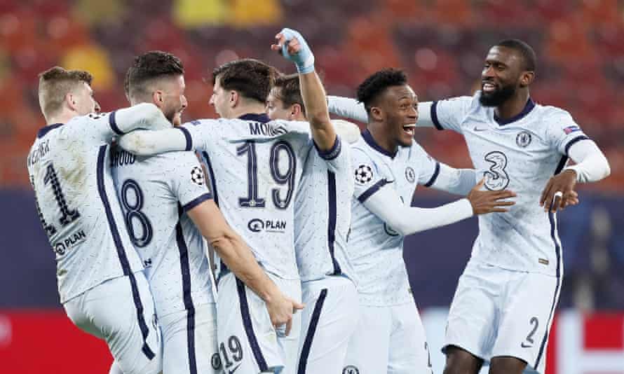Chelsea players celebrate with Olivier Giroud after his acrobatic winner.