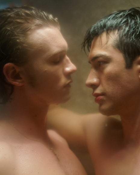 Two men standing in a shower