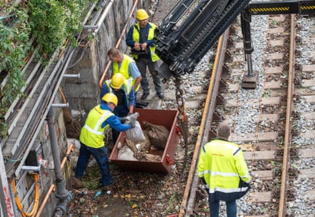 Fallen debris is removed from the U4 subway tracks in Vienna, Austria, after Storm Boris.