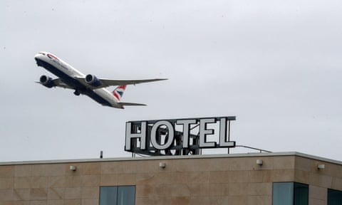 Plane flying over hotel