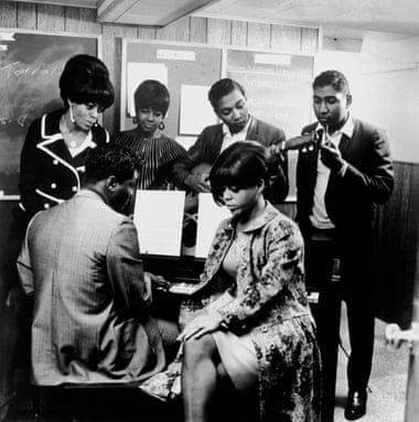 Lamont Dozier at the piano with, from left, Diana Ross, Mary Wilson, Eddie Holland, Florence Ballard (seated) and Brian Holland in the Motown studio in Detroit, Michigan, c1965.