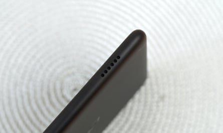 The speaker grill on the top edge of the Fire 7 tablet.