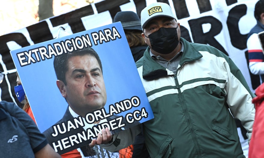 Protesters gather outside a court in New York calling for the extradition of President Juan Orlando Hernández.