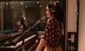woman in a recording booth with a microphone