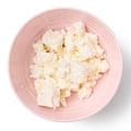 some cheeses. In a bowl. Stir in the crumbled white cheese, cover and leave to sit for 15 minutes. Meanwhile, grate the mozzarella.