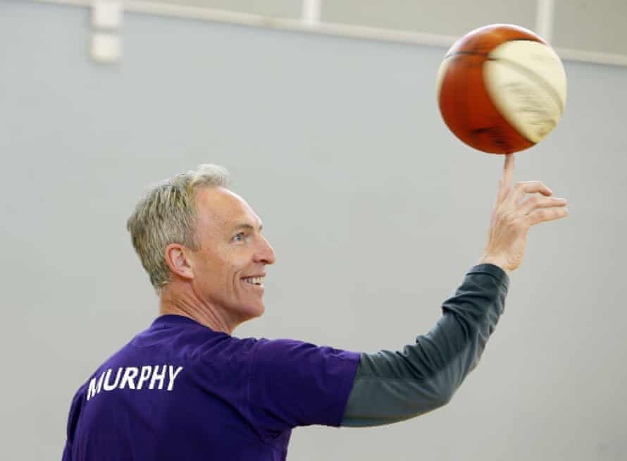 Jim Murphy plays basketball on the election campaign trail.