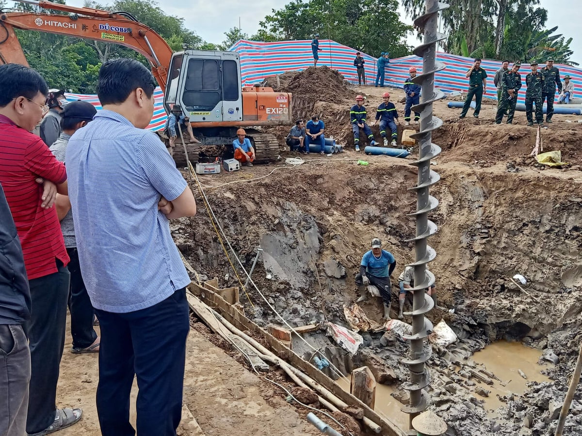 Rescuers in Vietnam battle to save boy trapped in construction site |  Vietnam | The Guardian